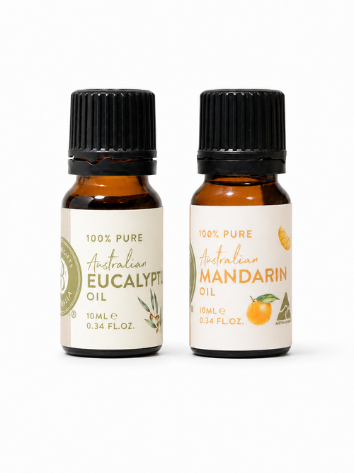 Two bottles of Australian essential oils on a white background