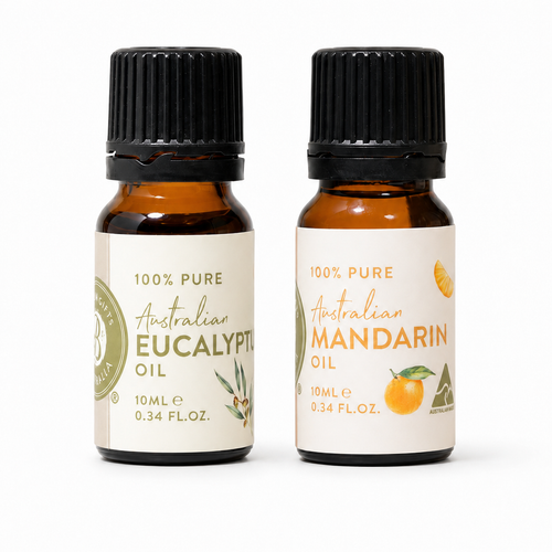 Two bottles of Australian essential oils on a white background