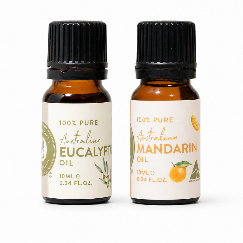 Two bottles of Australian essential oils on a white background