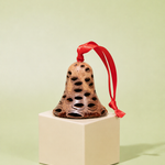 Handcrafted Banksia seed pod bell Christmas decoration with red ribbon on sage green